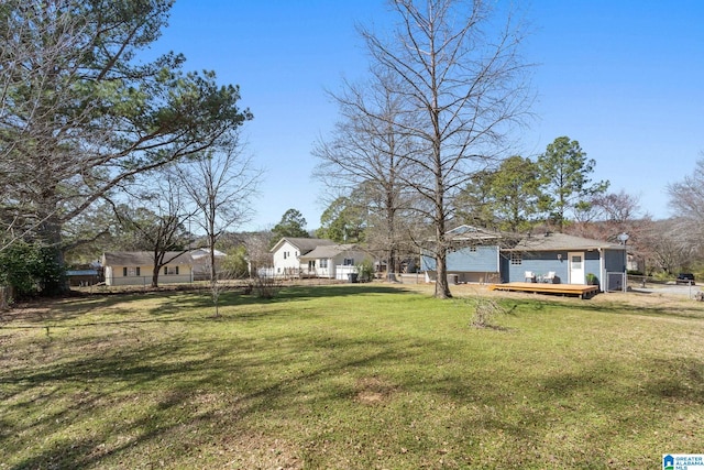 view of yard with fence and a deck