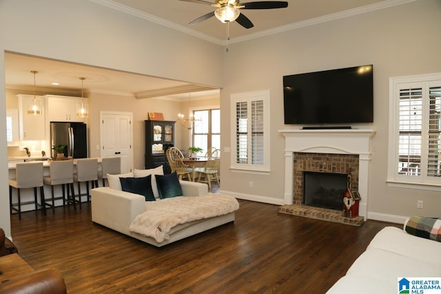 living room with a wealth of natural light, baseboards, dark wood-type flooring, and crown molding