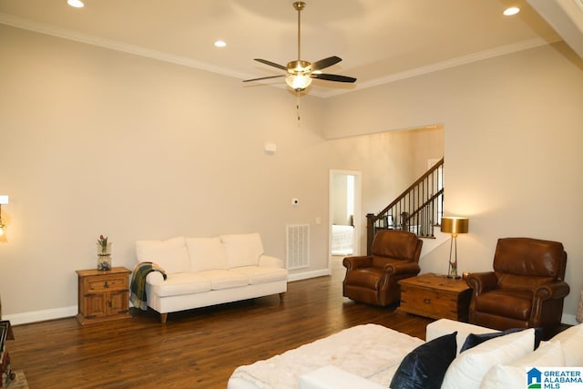 living area featuring visible vents, ornamental molding, wood finished floors, recessed lighting, and baseboards