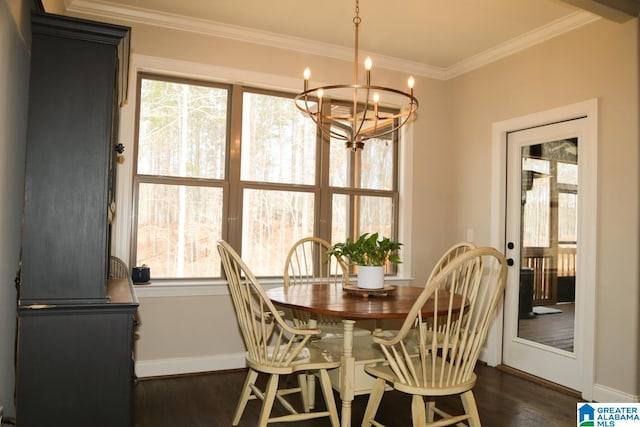 dining area featuring an inviting chandelier, crown molding, baseboards, and dark wood-style flooring