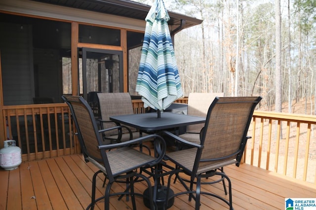 deck with outdoor dining area