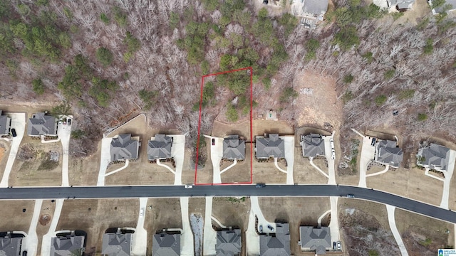 birds eye view of property with a residential view