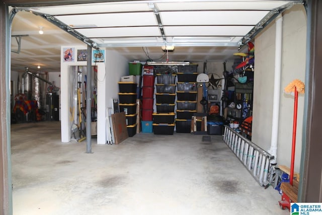 garage with a garage door opener and water heater