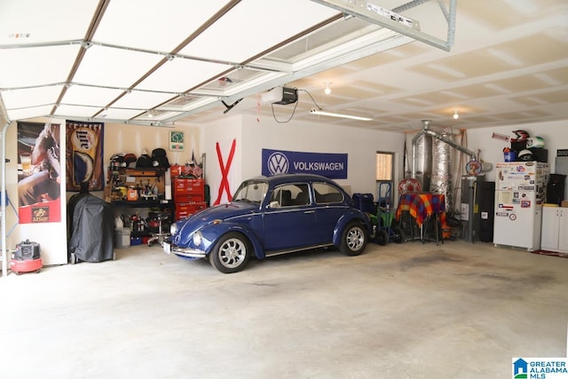 garage featuring a garage door opener and freestanding refrigerator