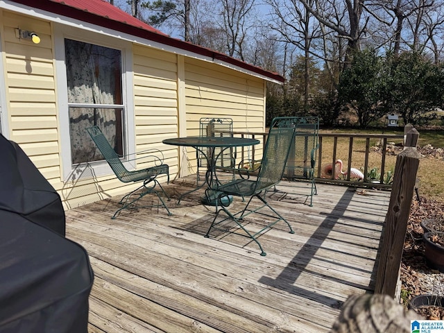 deck featuring outdoor dining area