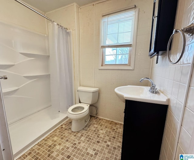 full bathroom with toilet, a shower stall, and tile walls