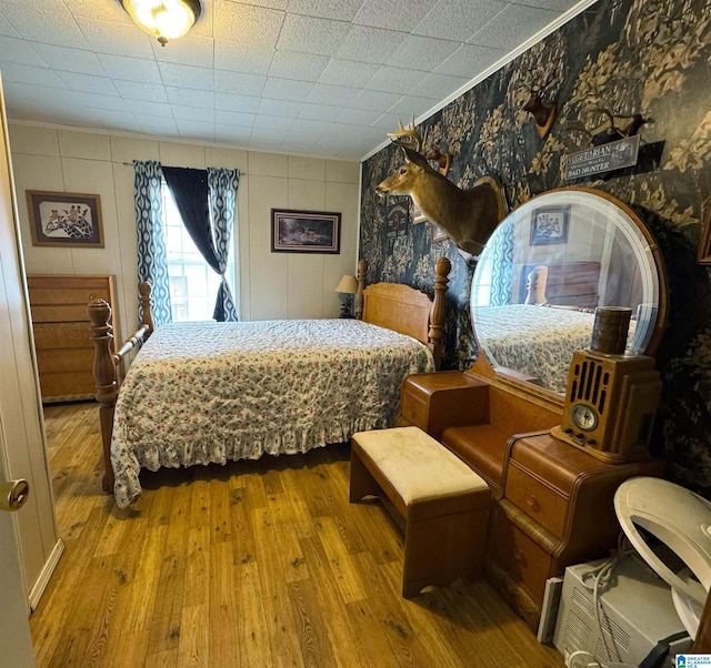 bedroom with wood-type flooring