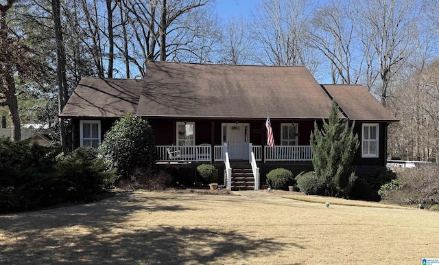 view of front of home with stairway and a porch