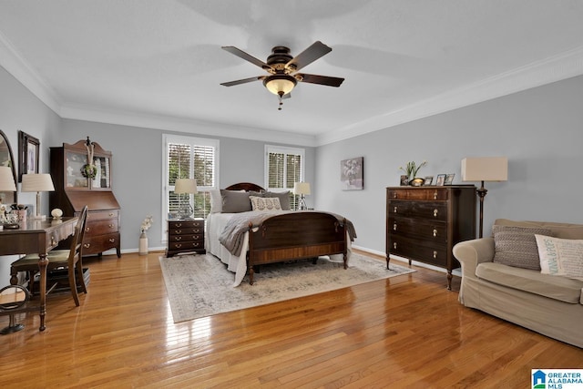 bedroom with crown molding, baseboards, a ceiling fan, and light wood-style floors