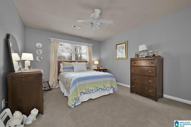 carpeted bedroom with ceiling fan, visible vents, and baseboards