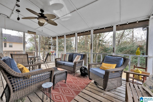 sunroom / solarium featuring ceiling fan