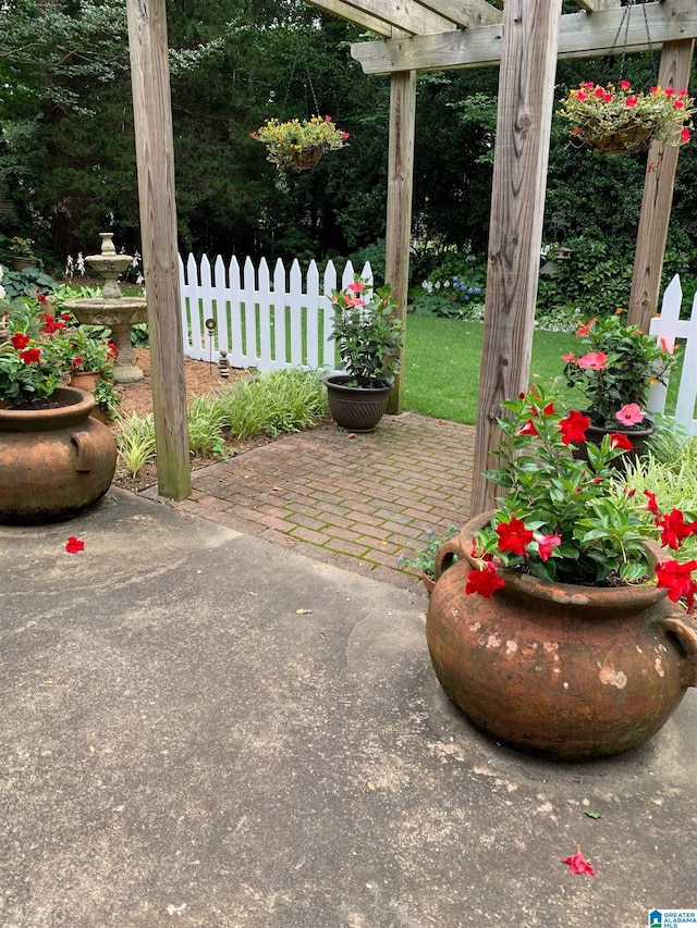 view of patio with fence and a pergola