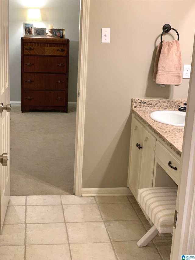 bathroom with vanity and baseboards