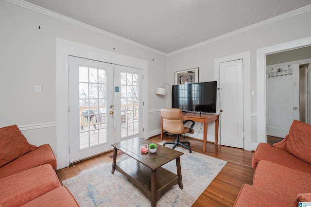 living room with ornamental molding, french doors, baseboards, and wood finished floors