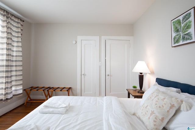 bedroom with wood finished floors