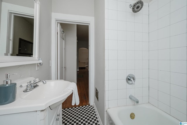 bathroom with vanity and shower / bath combination