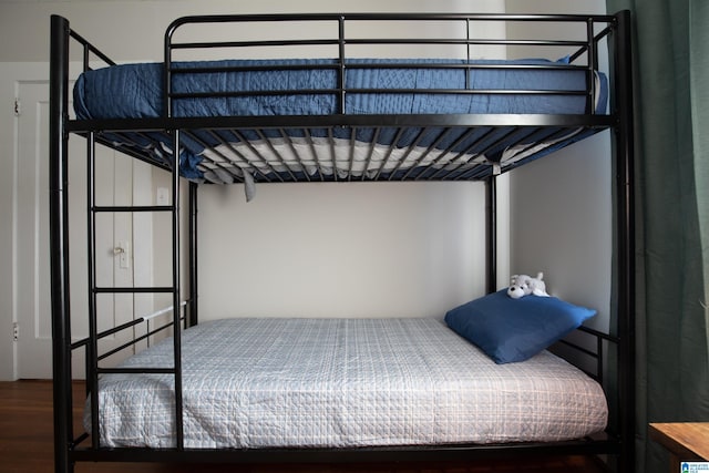 bedroom featuring wood finished floors