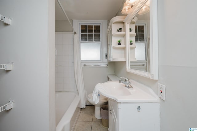 full bath featuring tile patterned flooring, toilet, vanity, and shower / tub combo