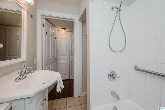 full bath featuring tile patterned floors, shower / bathing tub combination, and vanity