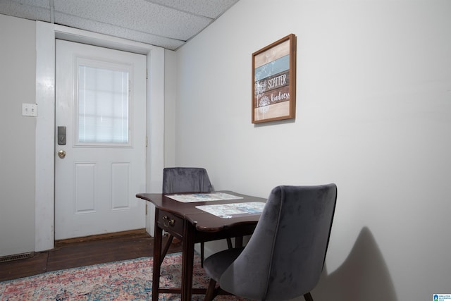 home office featuring a paneled ceiling and wood finished floors