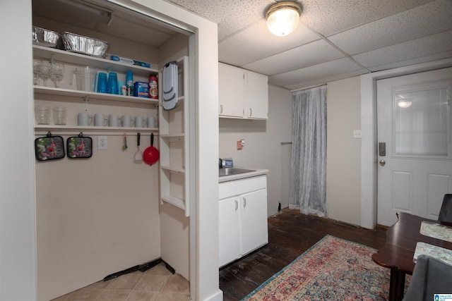 washroom featuring laundry area, light wood-style floors, and a sink