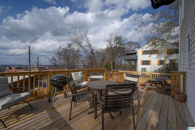 wooden deck with outdoor dining area