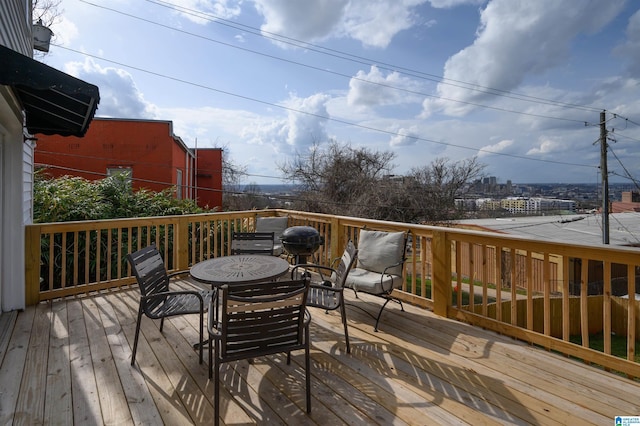 wooden deck with outdoor dining space