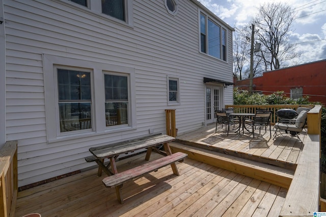 wooden deck featuring outdoor dining space