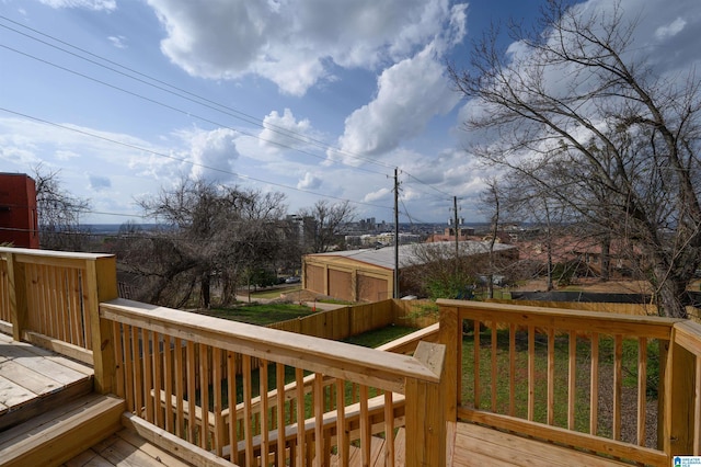 wooden deck featuring a lawn and fence