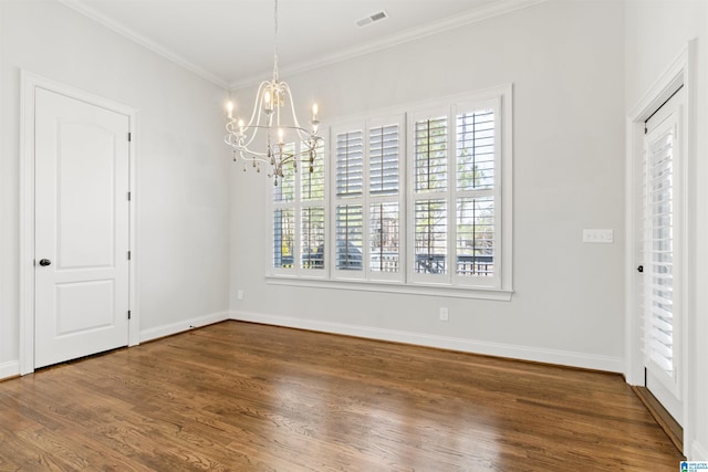 unfurnished dining area featuring crown molding, a notable chandelier, visible vents, wood finished floors, and baseboards