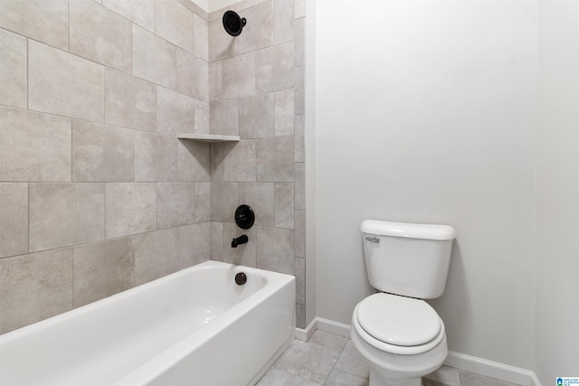 bathroom with shower / washtub combination, baseboards, and toilet