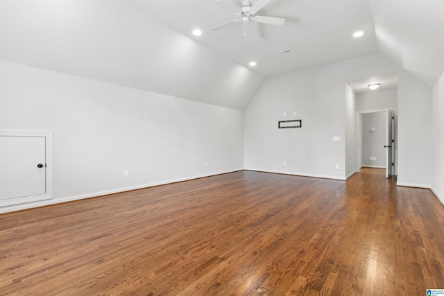 additional living space featuring recessed lighting, dark wood-type flooring, a ceiling fan, baseboards, and vaulted ceiling