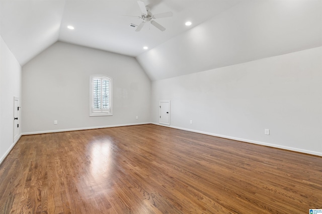 bonus room with baseboards, visible vents, a ceiling fan, wood finished floors, and vaulted ceiling