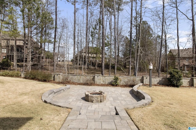 view of yard with an outdoor fire pit and a patio