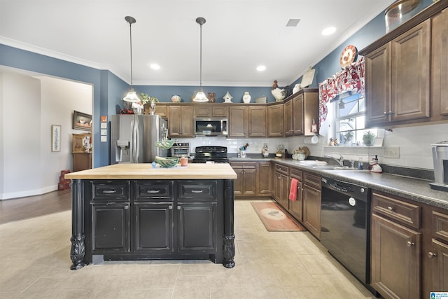 kitchen with backsplash, a kitchen island, ornamental molding, black appliances, and a sink