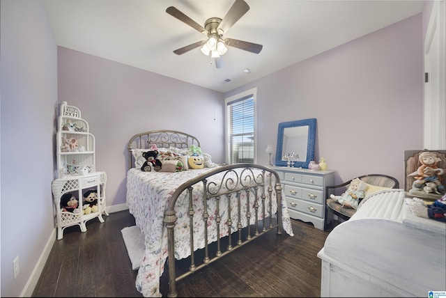 bedroom featuring dark wood-style floors, visible vents, ceiling fan, and baseboards