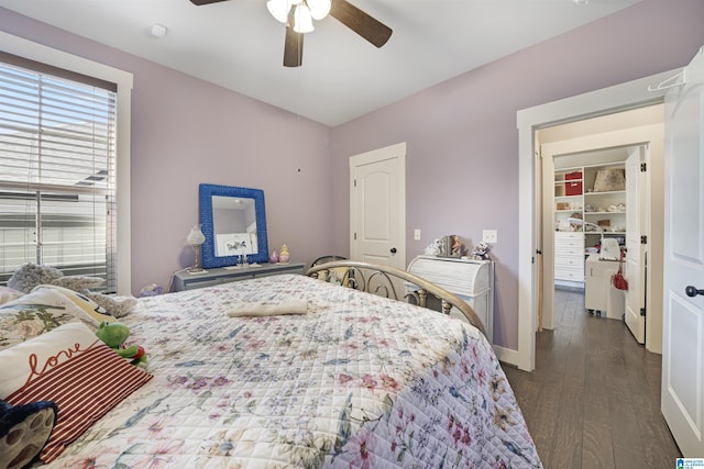 bedroom with ceiling fan, baseboards, and wood finished floors