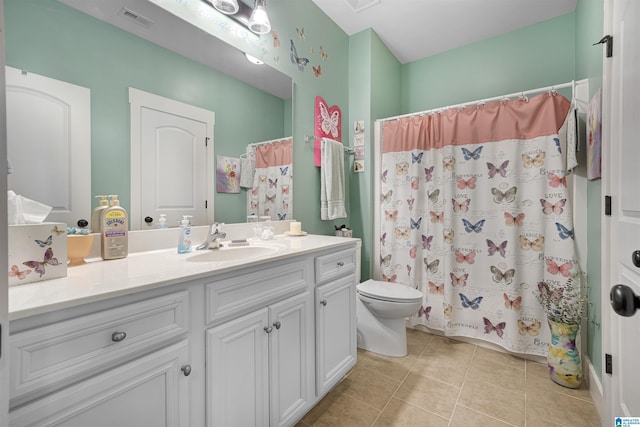 full bath featuring vanity, a shower with shower curtain, visible vents, tile patterned flooring, and toilet