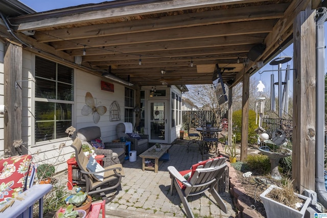 view of patio / terrace featuring fence