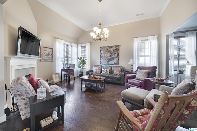 living area featuring plenty of natural light, a notable chandelier, lofted ceiling, and dark wood-style floors