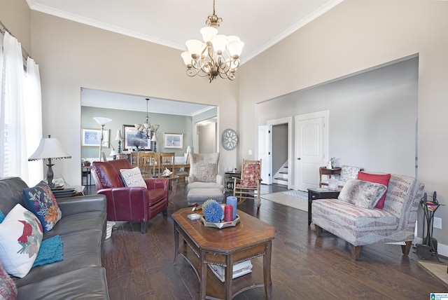 living area featuring wood finished floors, an inviting chandelier, stairs, a towering ceiling, and crown molding