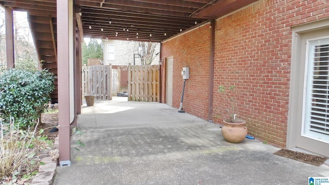 view of patio / terrace featuring fence