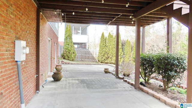 view of patio featuring fence