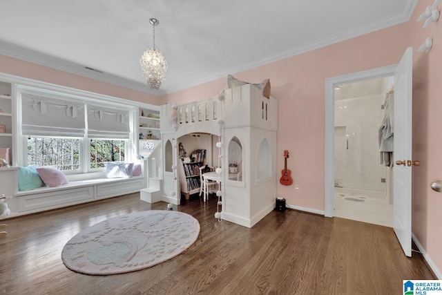 bedroom with arched walkways, wood finished floors, and crown molding