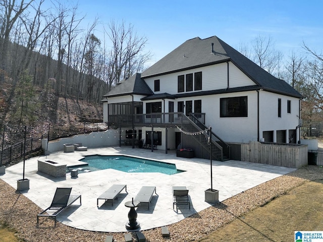 view of pool featuring a deck, stairway, a patio area, and fence private yard