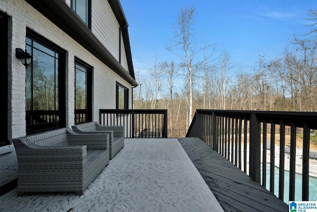 wooden deck featuring outdoor dining area