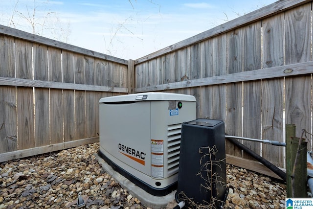 exterior details featuring fence and a power unit