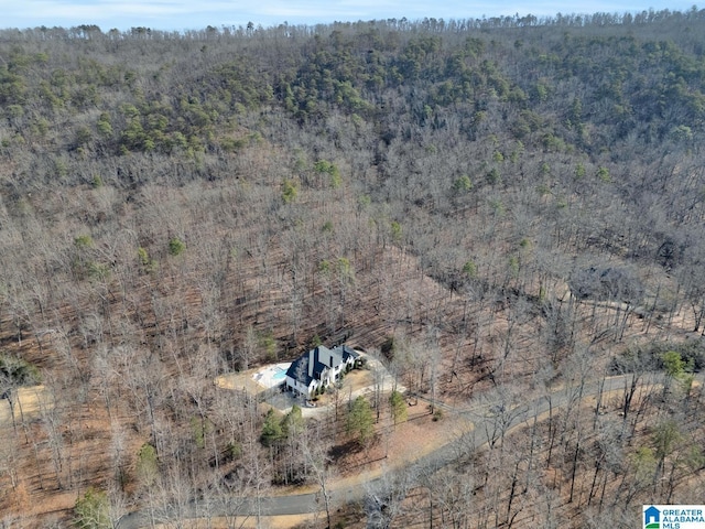 aerial view featuring a wooded view