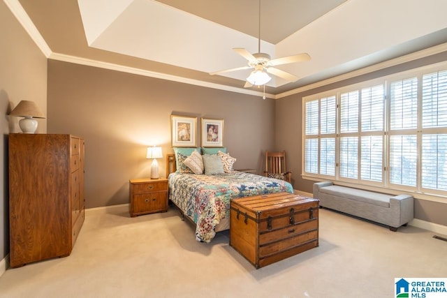 bedroom with light carpet, baseboards, visible vents, ornamental molding, and a tray ceiling