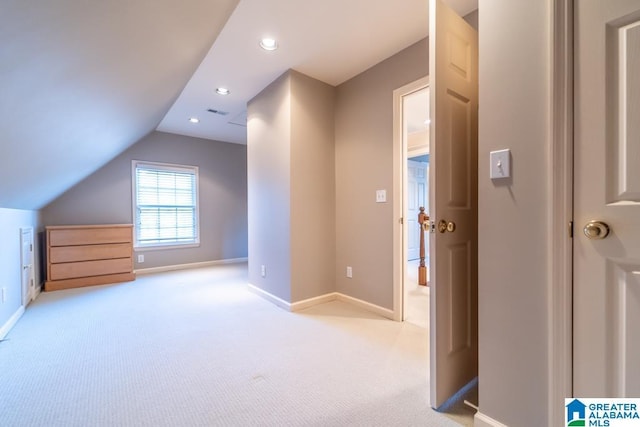 bonus room featuring recessed lighting, light carpet, vaulted ceiling, and baseboards